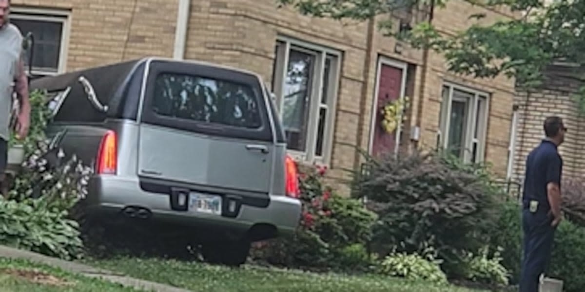 Hearse hits Canton apartment building after car runs stop sign, police say