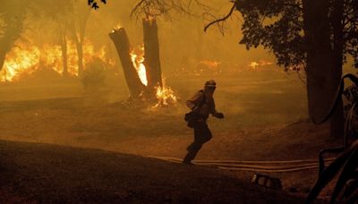 Northern California wildfire forces 13,000 people to evacuate, hotter times ahead