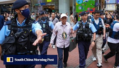 Hong Kong police remove pair marking 35th anniversary of Tiananmen crackdown