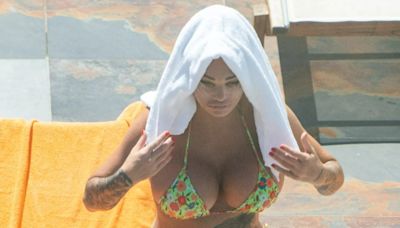 Katie Price spotted on holiday as warrant is out for her arrest in UK