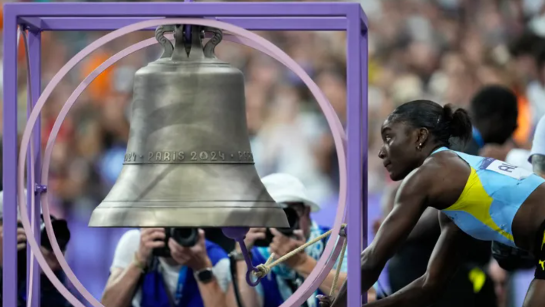 Why do Olympic athletes ring a bell at Stade de France?