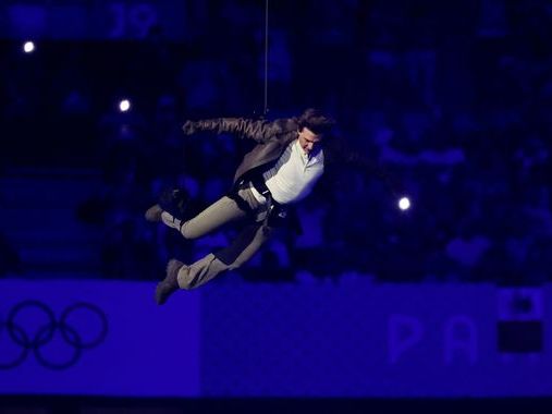 Paris Olympics closes with dystopian ceremony - as Tom Cruise abseils into stadium and Billie Eilish performs new hit