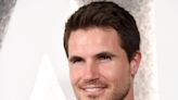Robbie Amell reveals how his 'EXmas' character is connected to 'Upload'