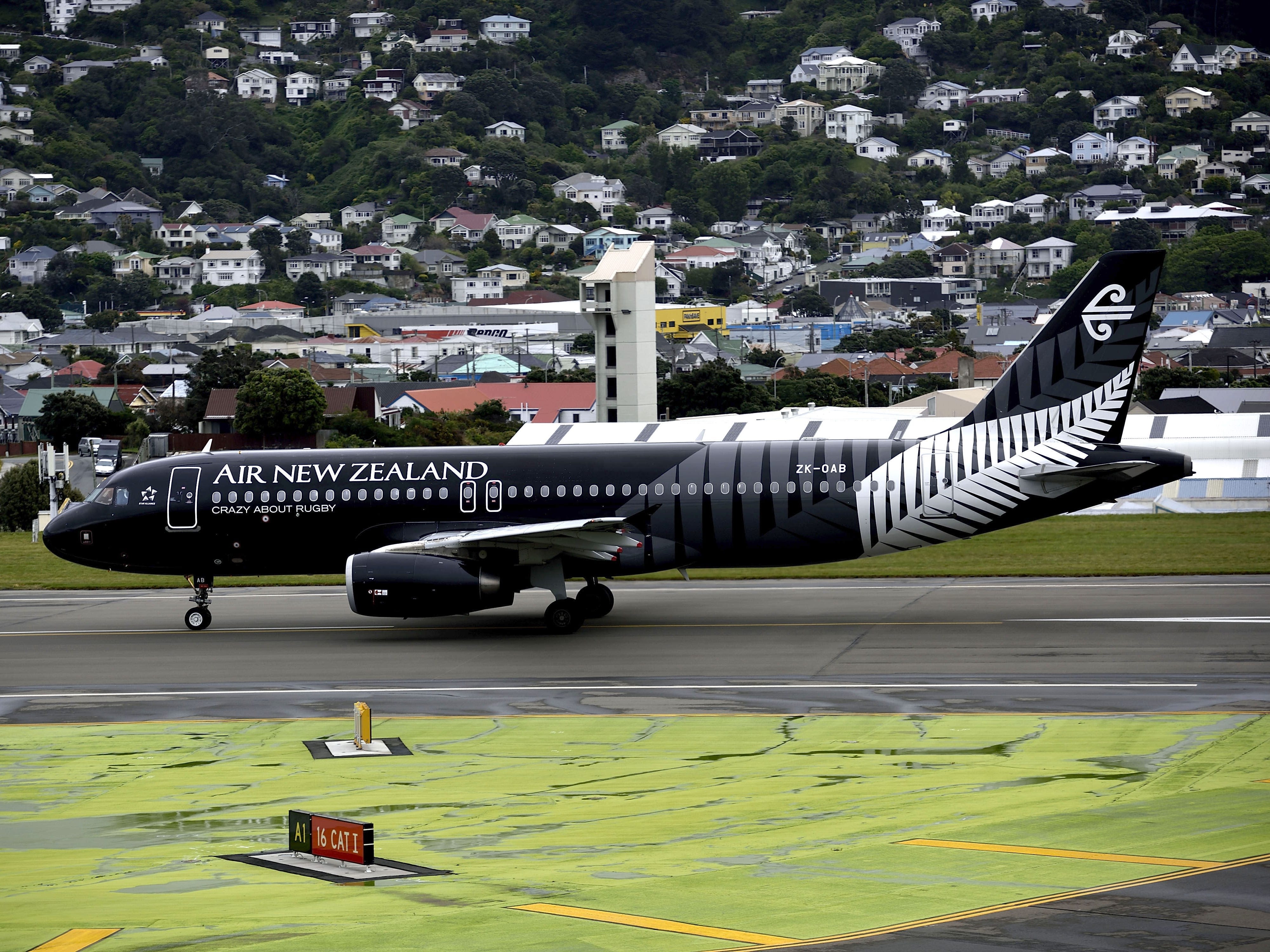 A crew member hit the ceiling and a passenger was scalded by spilled coffee as turbulence caused 'pandemonium' on a flight in New Zealand