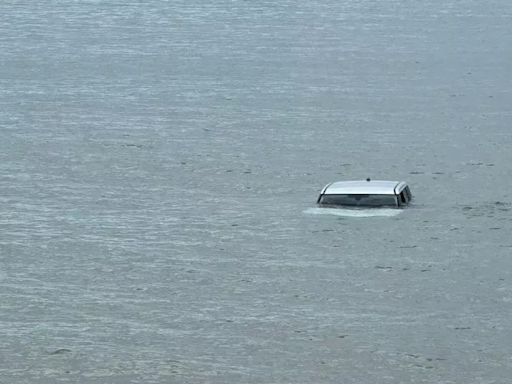 Car stranded in the North Sea after reportedly rolling into the water in Northumberland