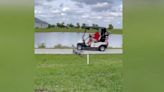 Watch as alligator lunges at golfers in a cart on a Florida course. ‘Oh my God.’