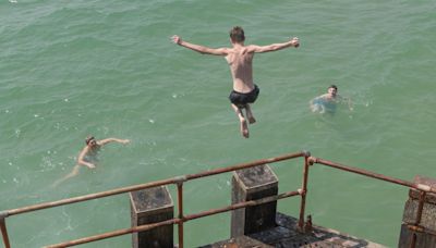 Sunseekers pack out beaches to bask in 28C as sun returns in time for weekend