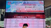 Asian stocks fall as investors await U.S. profits, inflation