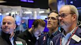 Wall Street ends near flat ahead of inflation data