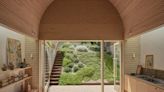 An Arched Timber Vault Promises Privacy Within This Tasmanian Cottage