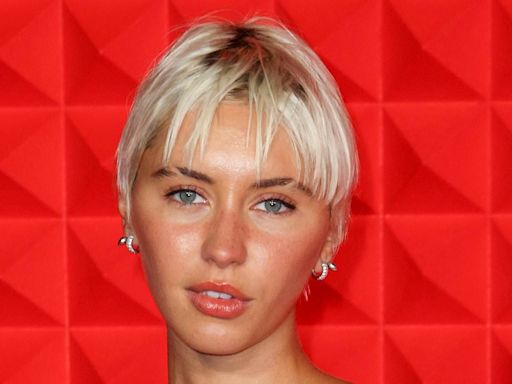 Newly single Iris Law stuns in a grey dress at Charli XCX's LFW party