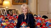 Camilla pictured with dozens of Paddington Bears left as tributes to the Queen