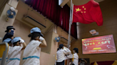 School children sang anthem too softly - Hong Kong