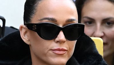 Katy Perry goes braless in a perilously plunging fur jacket