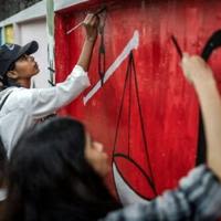 Students who led the weeks of protests that toppled autocratic premier Sheikh Hasina are painting over slogans calling on her to quit with messages of hope for the future