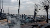 Houseboats catch fire on a lake popular with tourists, killing 3 in Indian-controlled Kashmir