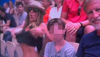 Olympics fans stunned as woman flashes her BOOBS while alongside child