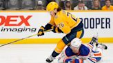 How does Nashville Predators center Philip Tomasino handle being a healthy scratch?