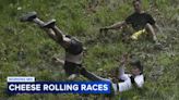 Dozens roll down Cooper's Hill in annual cheese-chasing race in England