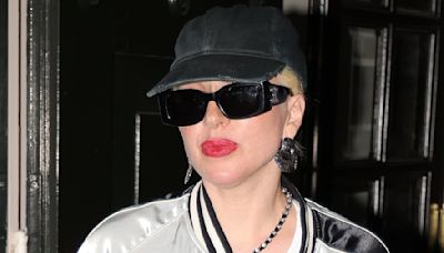 Lady Gaga looks sporty in a satin bomber jacket after dinner in Paris