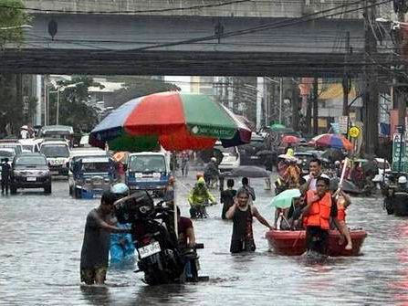 A typhoon kills 3 as it nears Taiwan. It killed 13 in the Philippines, where people plead for rescue