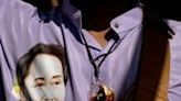 File image of a Burmese protester wearing a shirt depicting detained Myanmar civilian leader Aung San Suu Kyi during a demonstration in Bangkok