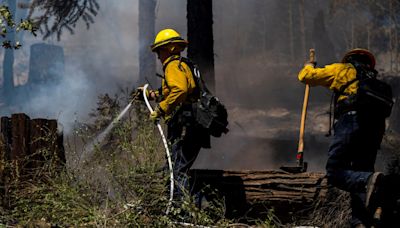 Firefighters make progress against massive blaze in California ahead of warming weather