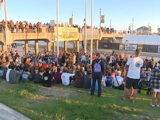 Vigil held for missing Huntington Beach swimmer as Coast Guard calls off search