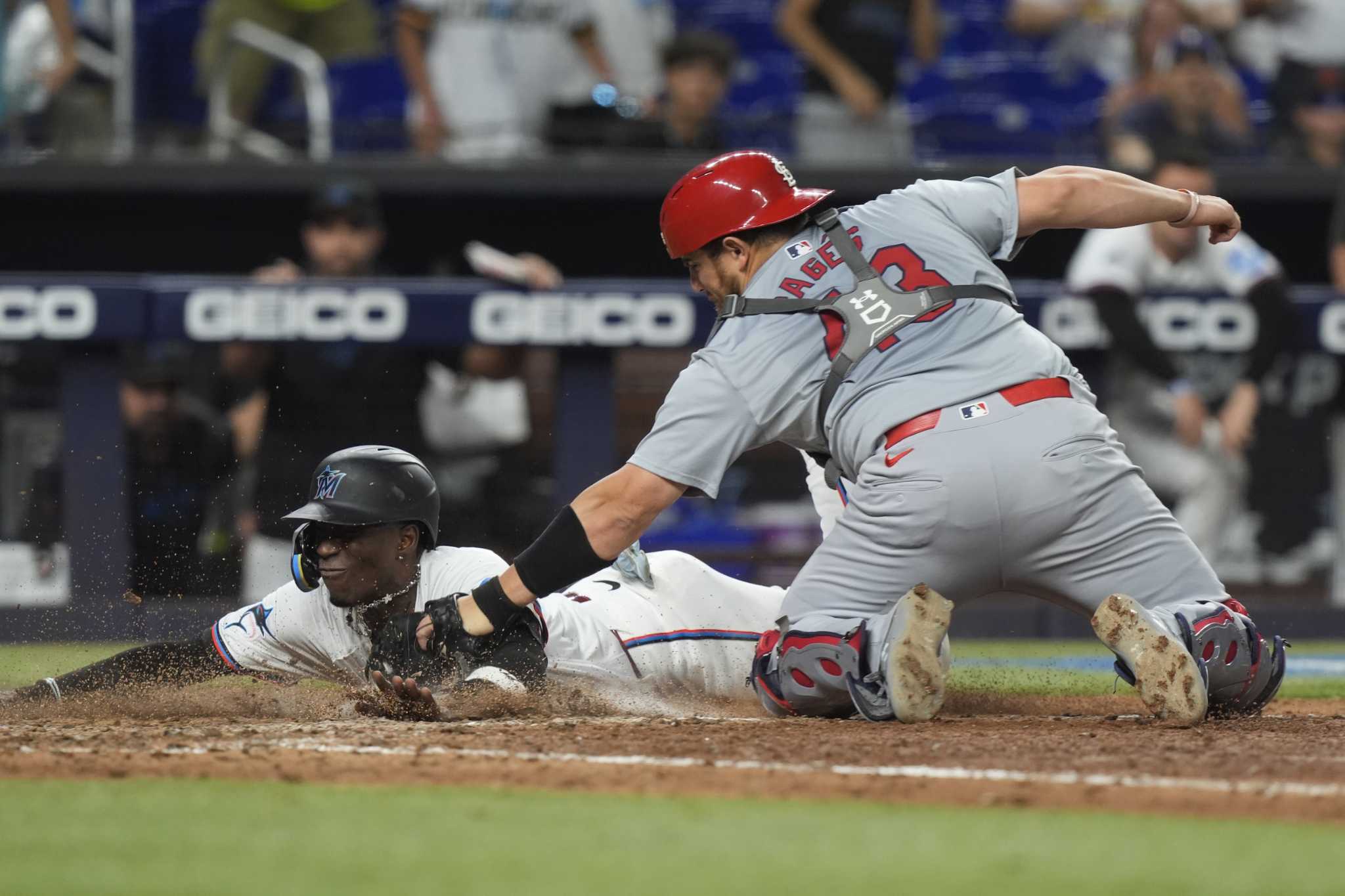 Winn's homer in 12th, Carlson's throw lead Cardinals over Marlins for 1st winning record since April