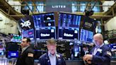 Wall St sinks after weak data, hawkish Fed comments