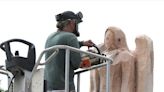 Chainsaw artist carves angel into 100-year-old oak tree trunk at Westchester funeral home