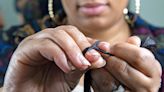 ‘I know my roots’: Hair braider brings generations of Black expression to her work