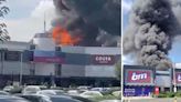 Huge factory fire breaks out with smoke plume visible 15 miles away