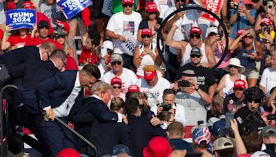 Haunting moment Trump rally crowd prays for him together after shooting