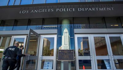 Investigation underway after video shows LAPD officer punch handcuffed man