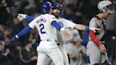 Swanson's tiebreaking 2-run homer, Suzuki's grand slam lift Cubs past Reds 7-5 at wet Wrigley Field