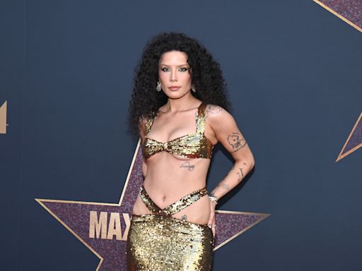 Halsey Channels Cher in Sequined Gold Gown With Hip Cutouts at ‘MaXXXine’ Premiere