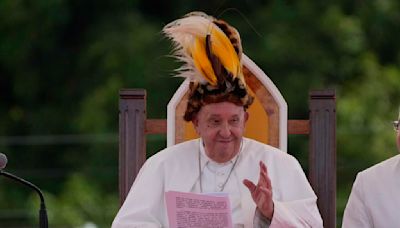 Pope arrives in the remote jungles of Papua New Guinea with a ton of humanitarian aid and toys