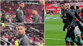 Marcus Rashford pulled away by teammates after row with Manchester United fan in stands