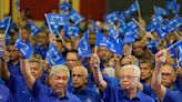 Unfazed by scandals, Malaysia’s old party seeks win in polls