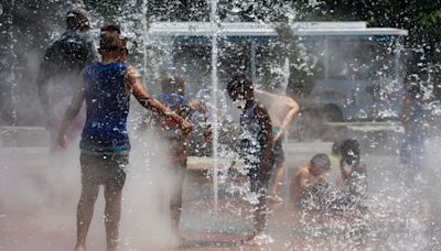 Scorching heat bakes the West as thunderstorms flood parts of the Northeast