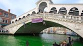 Venice’s Grand Canal dyed fluorescent green by climate activists