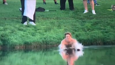 Fan strips down to retrieve pro's club from water at Valhalla
