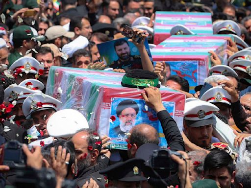 Iran inters its late president at holiest Shiite site in nation after fatal helicopter crash