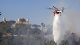 Wildfires continue to burn across Europe as temperatures remain high