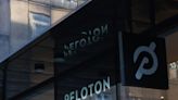 Peloton is trying to re-energize sales by placing its bikes where people can see and touch them, like malls and hotels. Some experts say it won't make much of a difference.