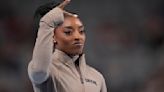 Simone Biles cruises to 9th national title and gives Olympic champ Sunisa Lee a boost along the way