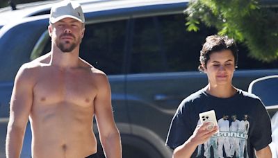 Derek Hough flaunts his his well-built torso as he walks shirt-free