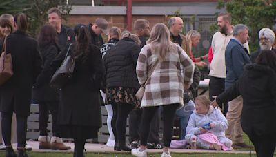 Community holds vigil to mourn three children killed in Sydney house fire