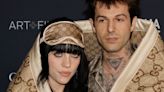 Billie Eilish Makes Red Carpet Debut With Boyfriend Jesse Rutherford Wrapped In Blanket